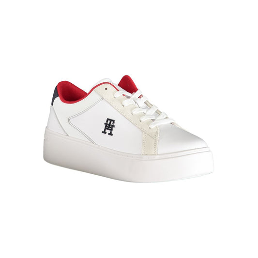 White sneaker with red accents, featuring a logo on the side and a low top design