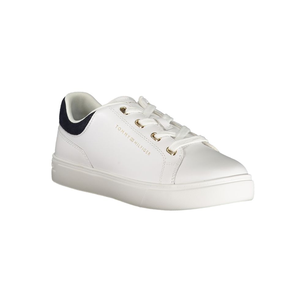 White sneaker with gold accents, laces, and logo