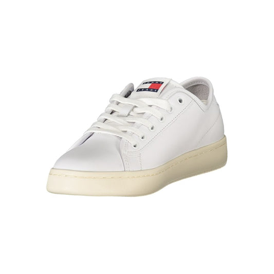 White sneakers with laces for women, featuring a logo on the side and a flat sole