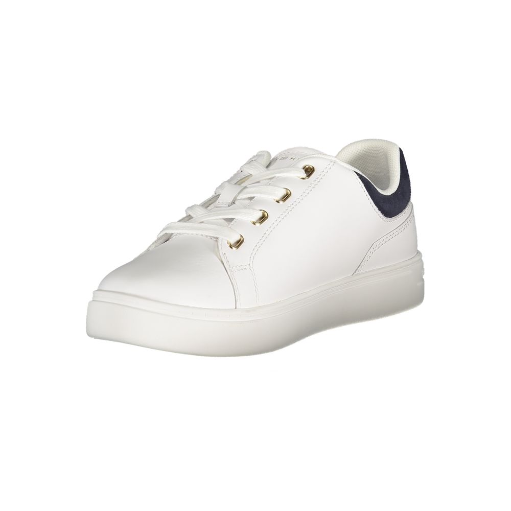 White sneaker with gold laces, featuring a low top design