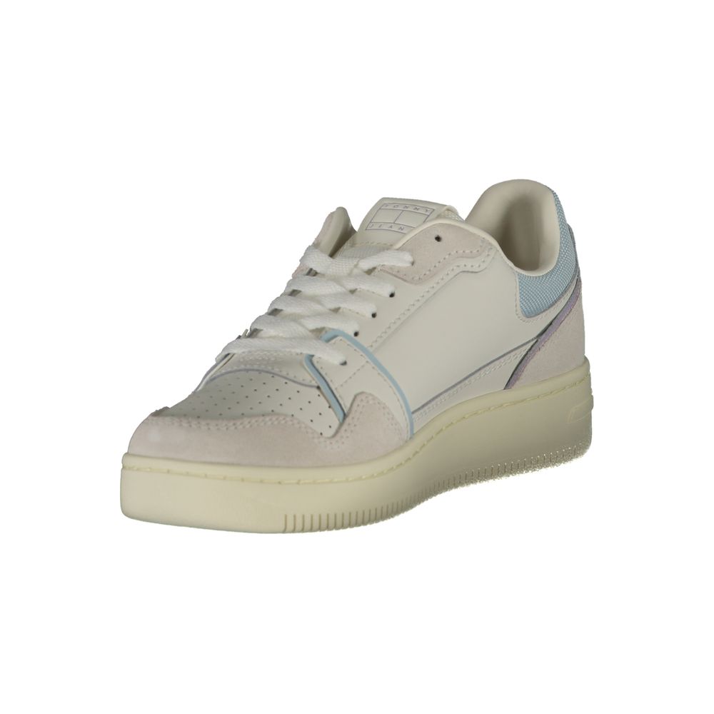 A women's sneaker with a white upper, blue accents, and a chunky sole