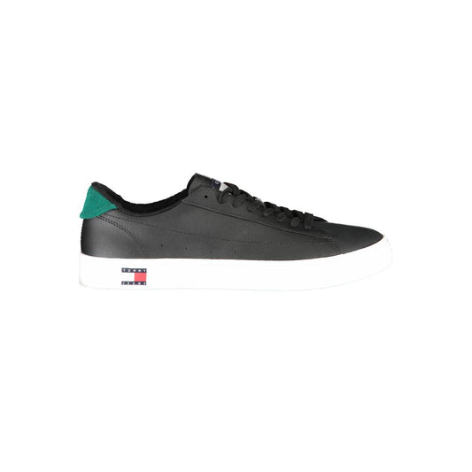 Black sneaker with white sole and green stripe on side
