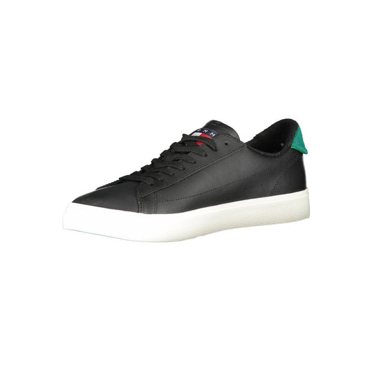Black sneaker with white sole and green laces