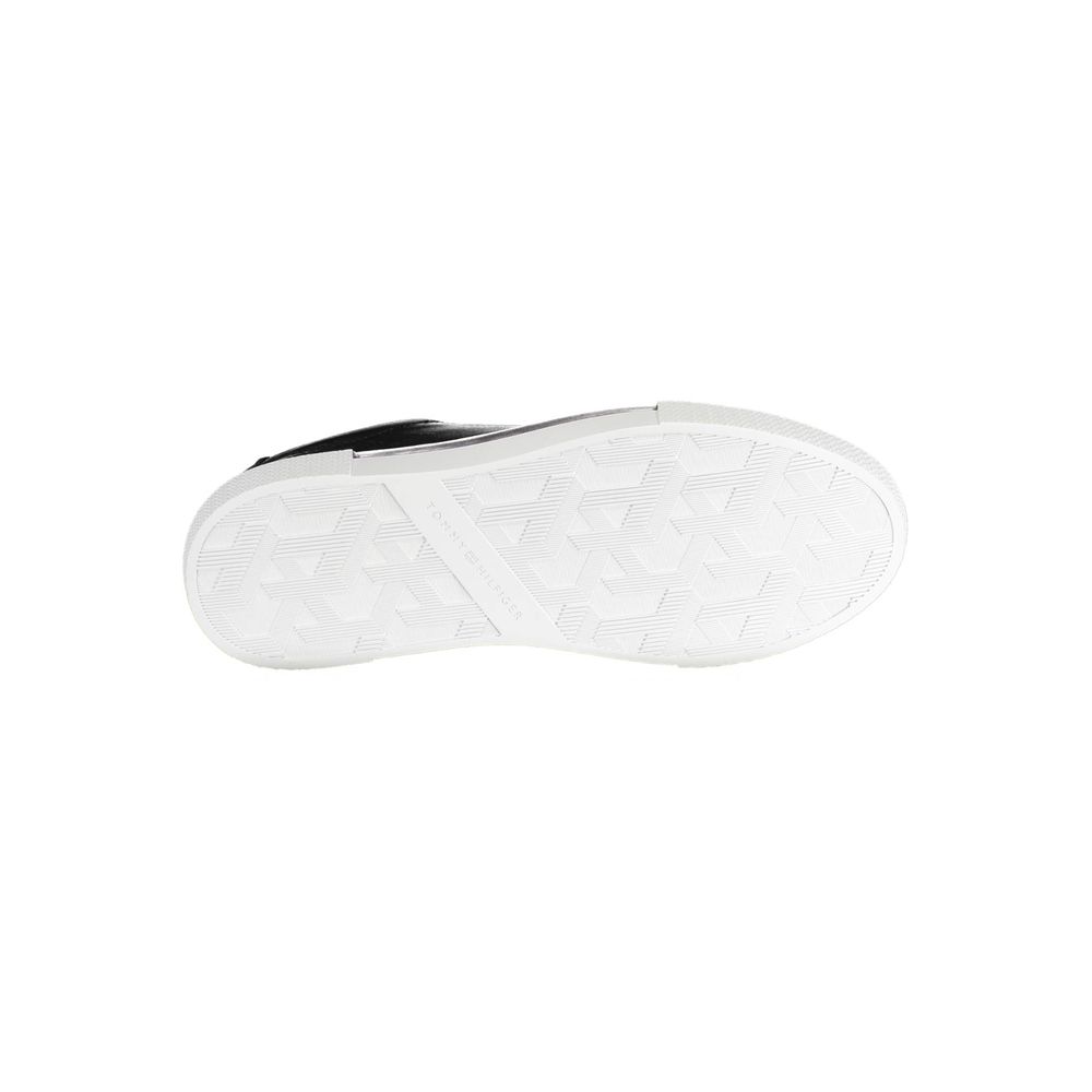 White sneaker with black laces and sole
