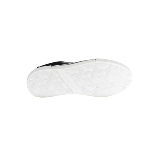 White sneaker with black laces and sole