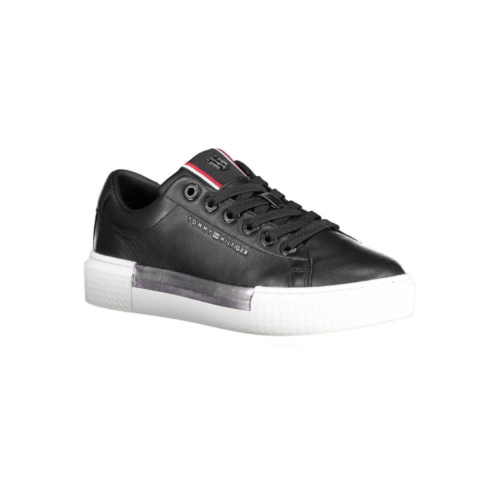 Black and white sneaker with red stripe on side