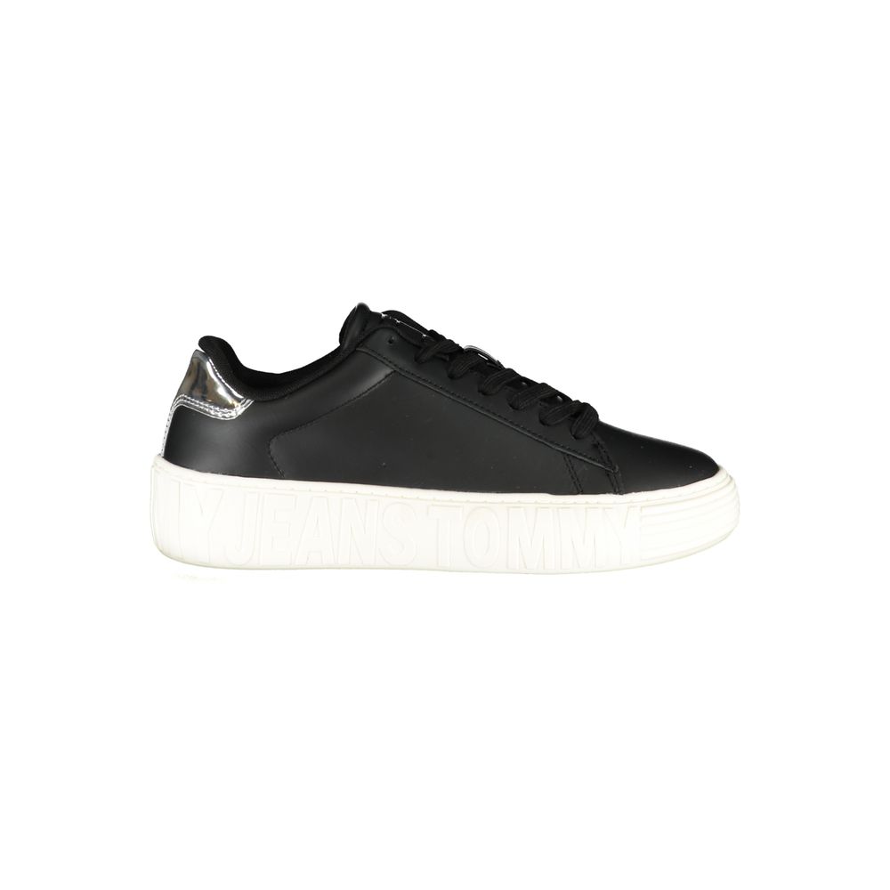 Black sneaker with white sole and laces