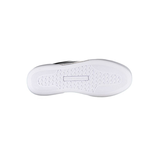 White sneaker with black logo on side