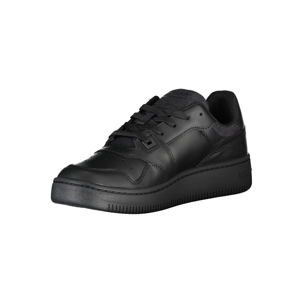 A black leather women's sneaker with a low top, lace-up front and a flat sole
