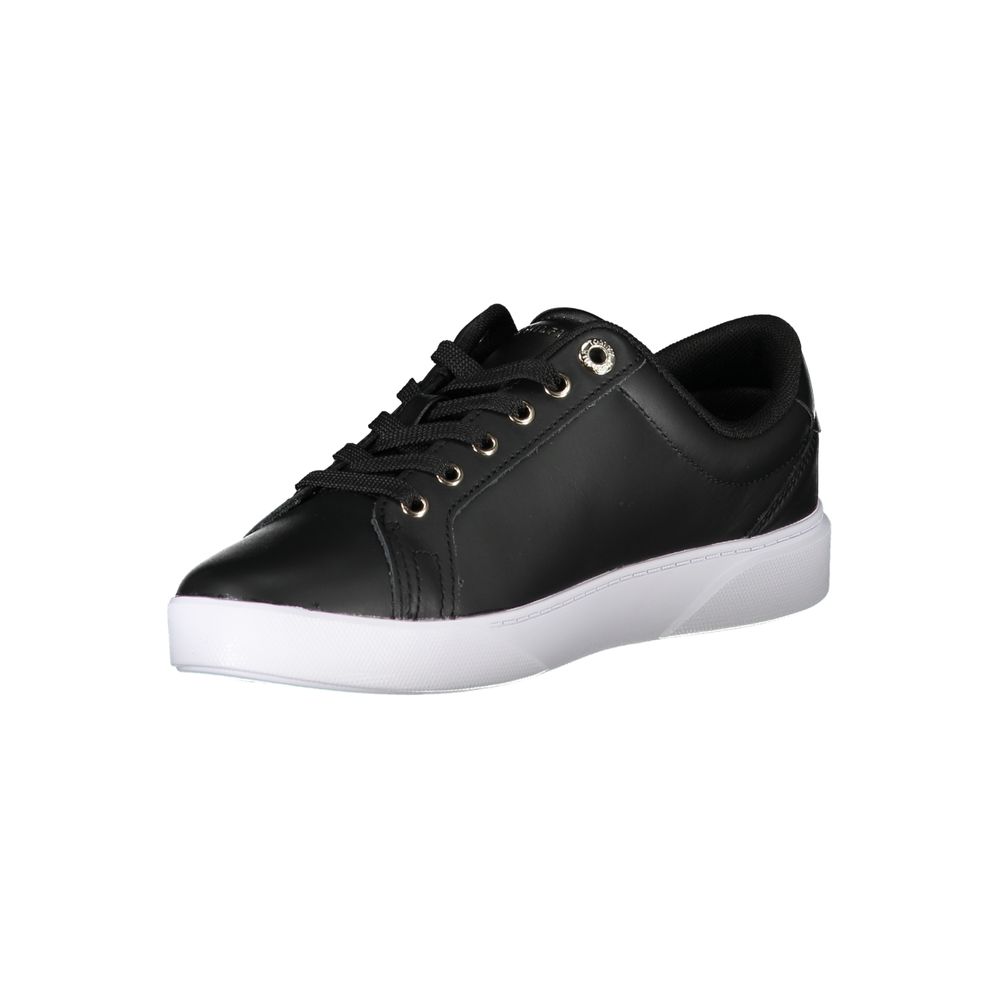 A black leather women's sneaker with white laces and a low top