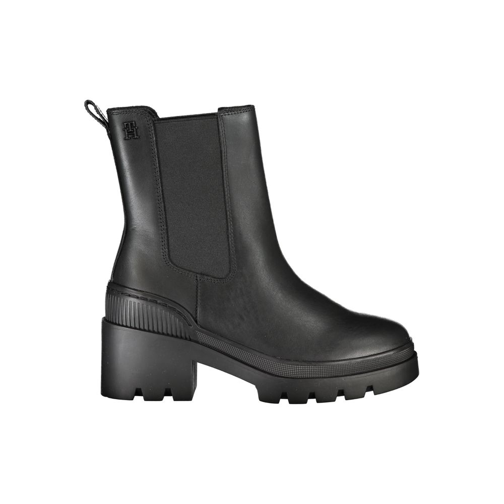 Black rubber boot with a chunky heel and platform sole