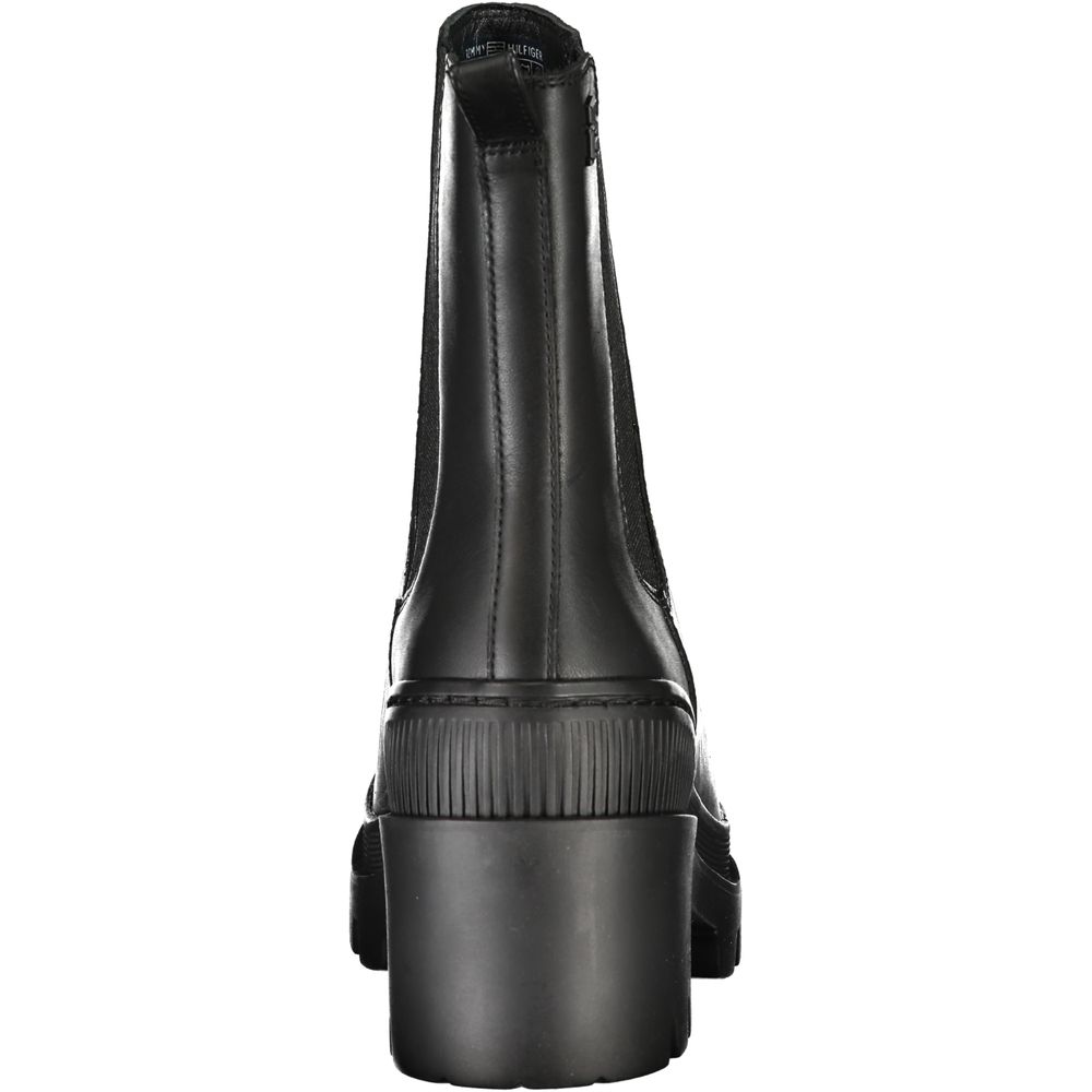 Black leather boot with zipper and buckle closure