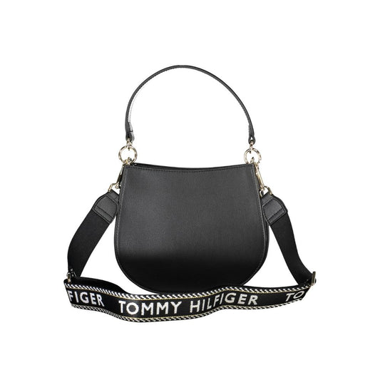 Black leather handbag with gold hardware and a strap featuring the brand name Tommy Hilfiger in white letters