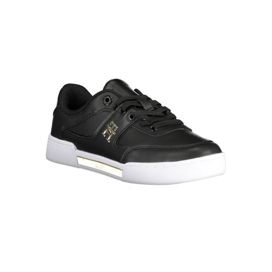 A black women's sneaker with white sole, featuring a gold logo on side and laces
