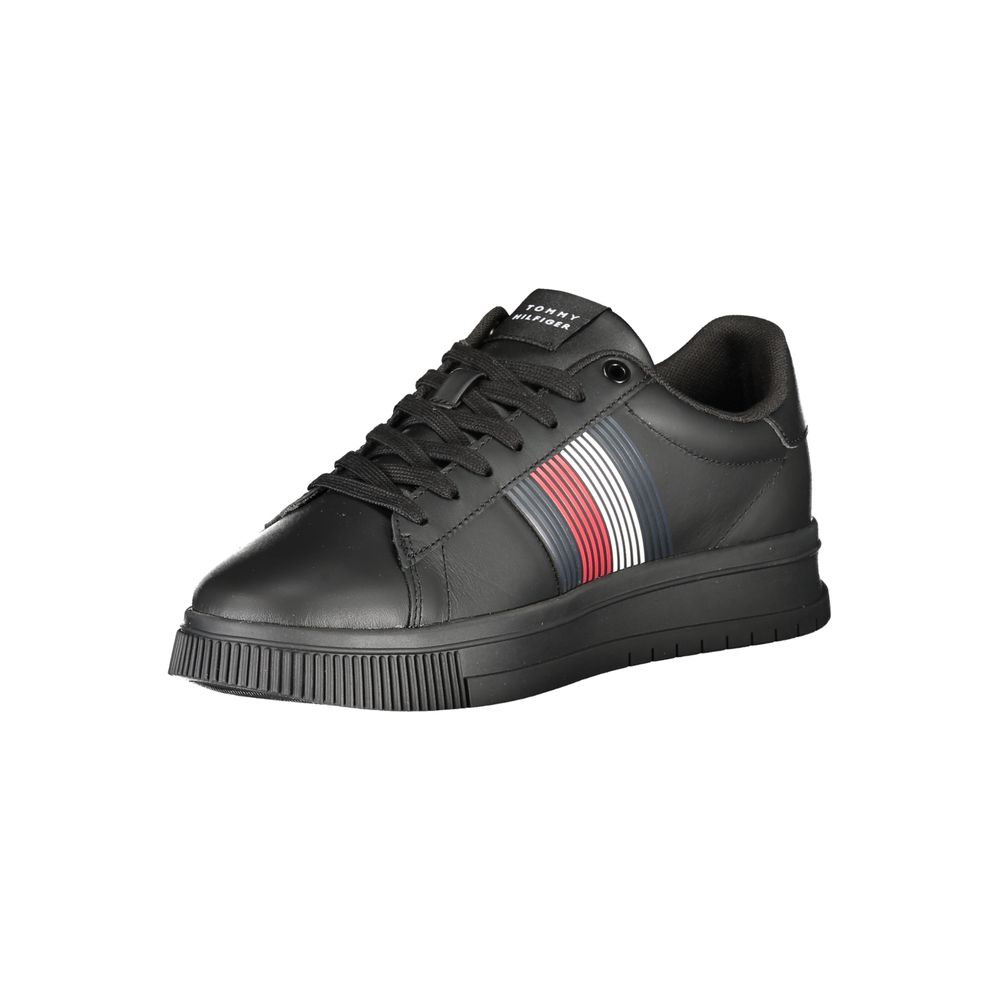 Black sneaker with red and white stripe on side