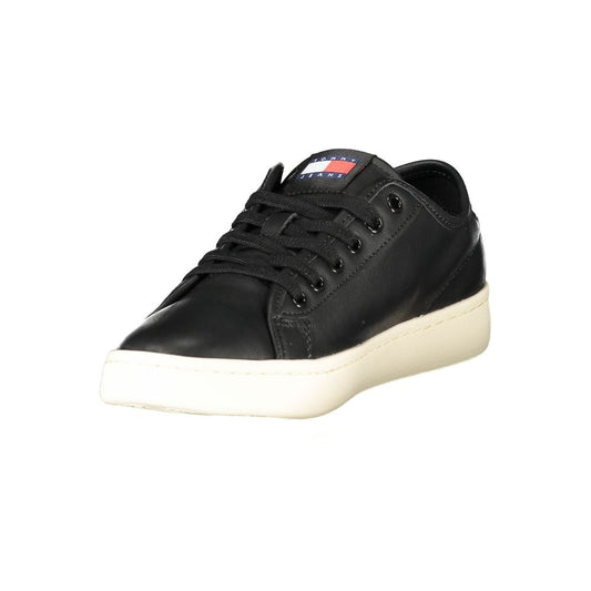 A black women's sneaker with a white sole, featuring a logo on the side and a lace-up front