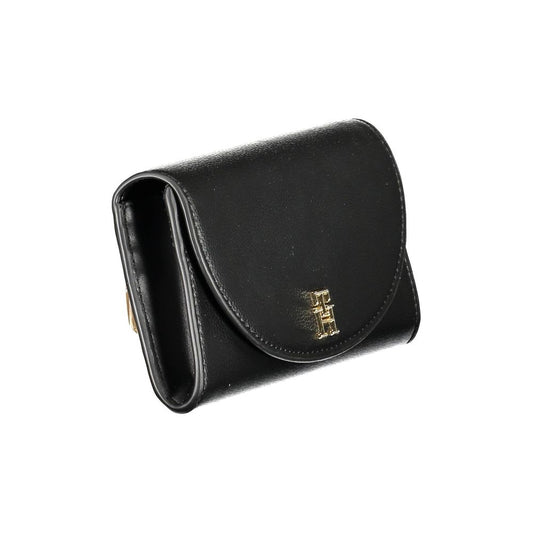 Black leather wallet with gold accents and a logo on the front