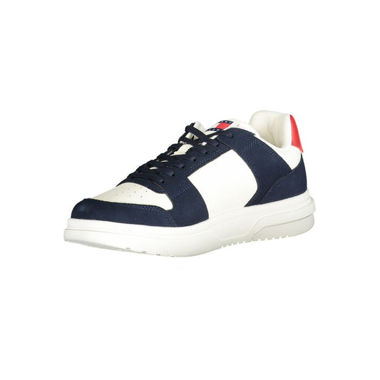Navy blue leather sneakers with white laces, red accents, and a white sole