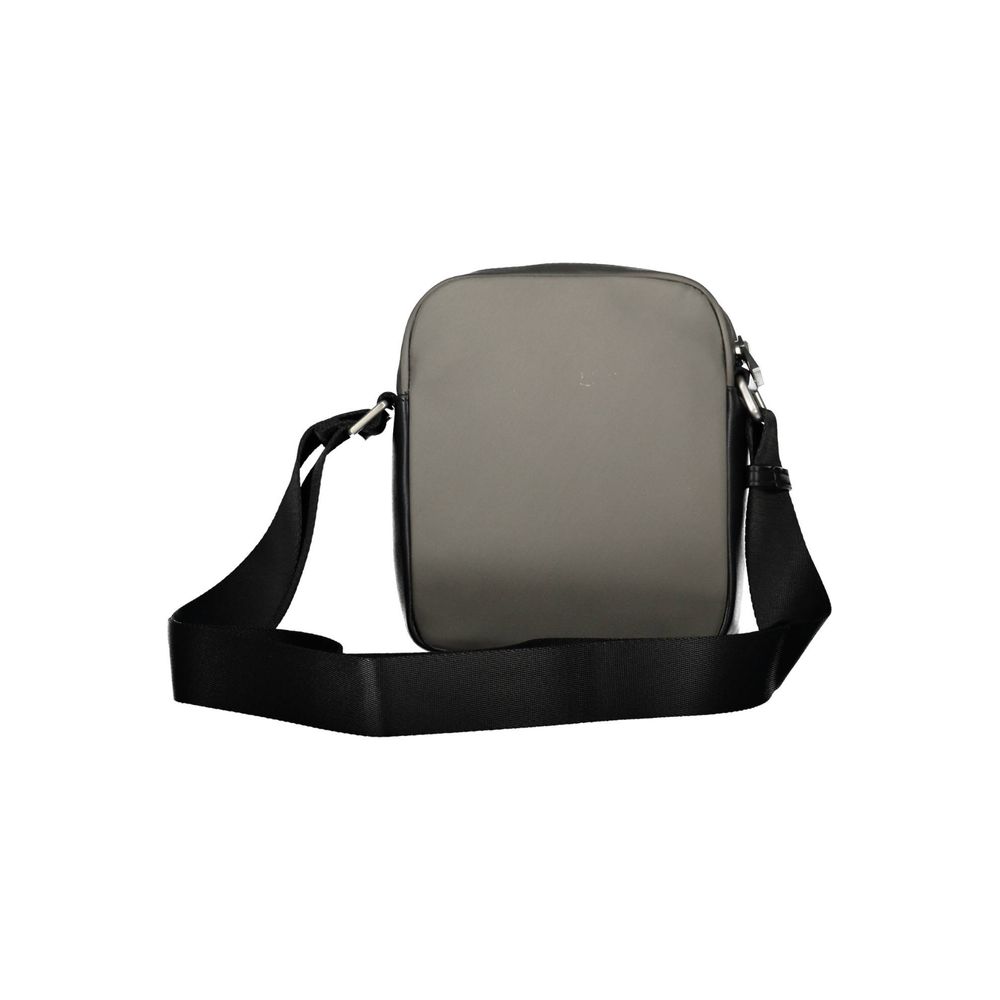 A gray pouch with black straps and a buckle closure
