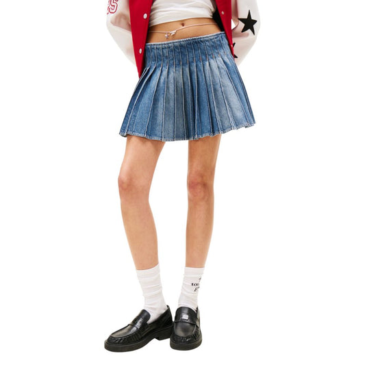 Girl wearing red jacket, denim skirt, white socks, black shoes