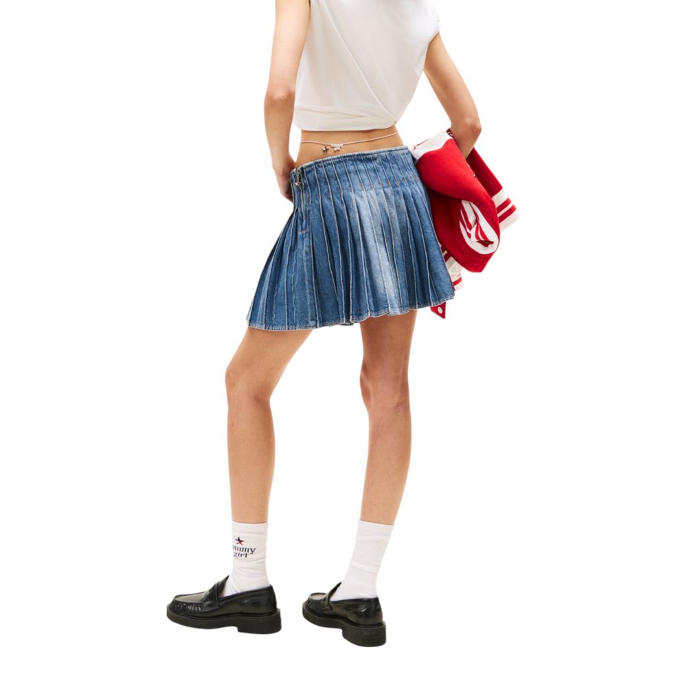 Woman wearing denim skirt and white t-shirt