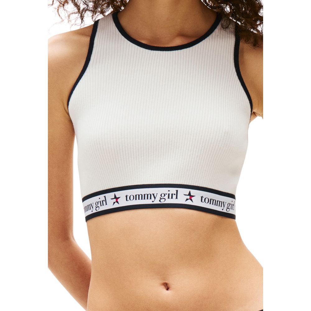 White tank top with black straps and brand name across chest