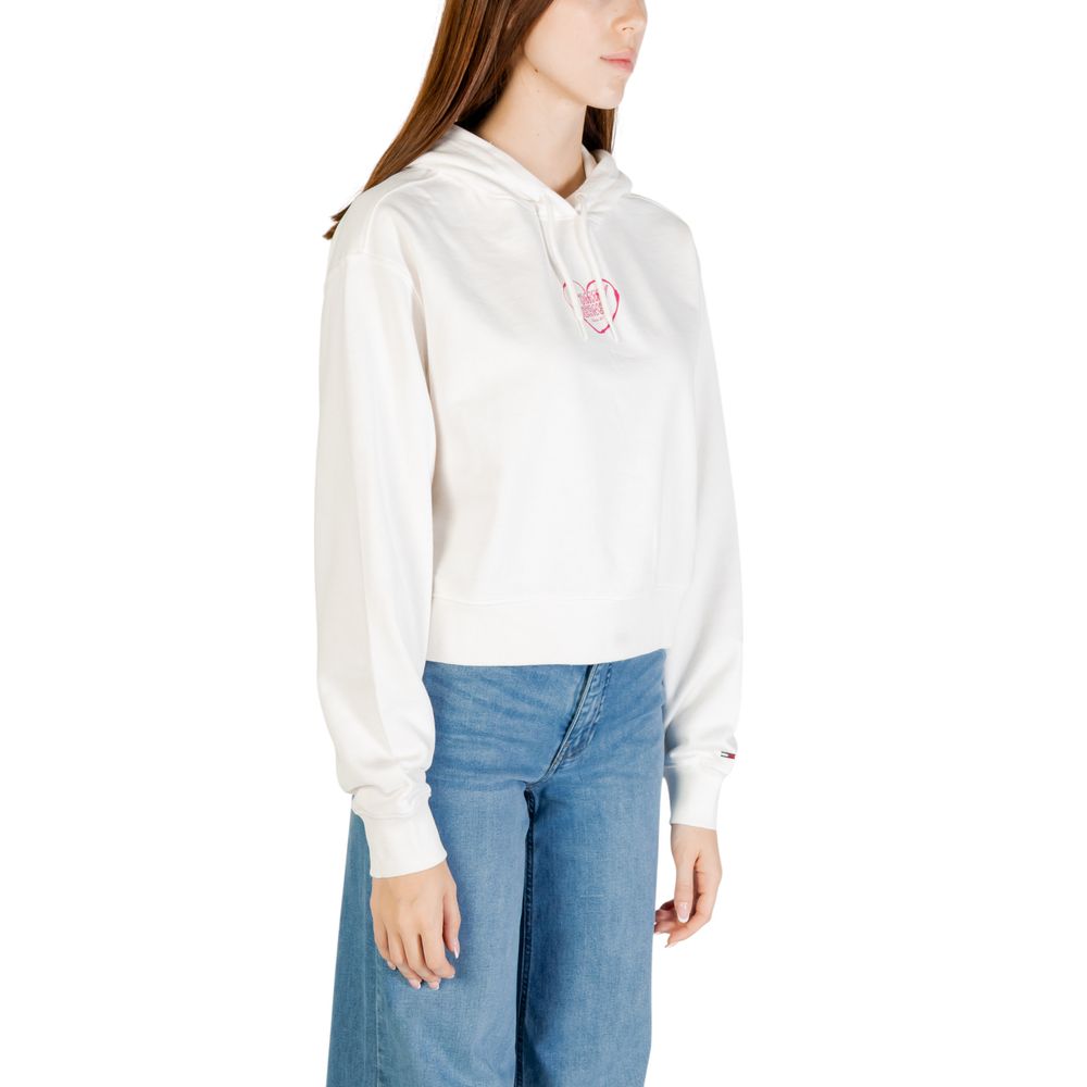Woman wearing white hoodie with pink logo