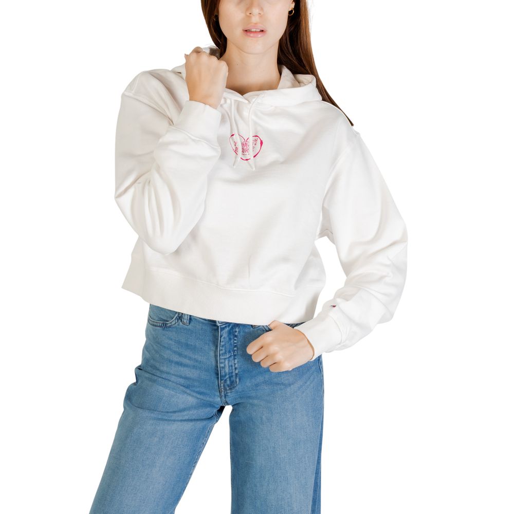 Woman wearing white hoodie with pink logo