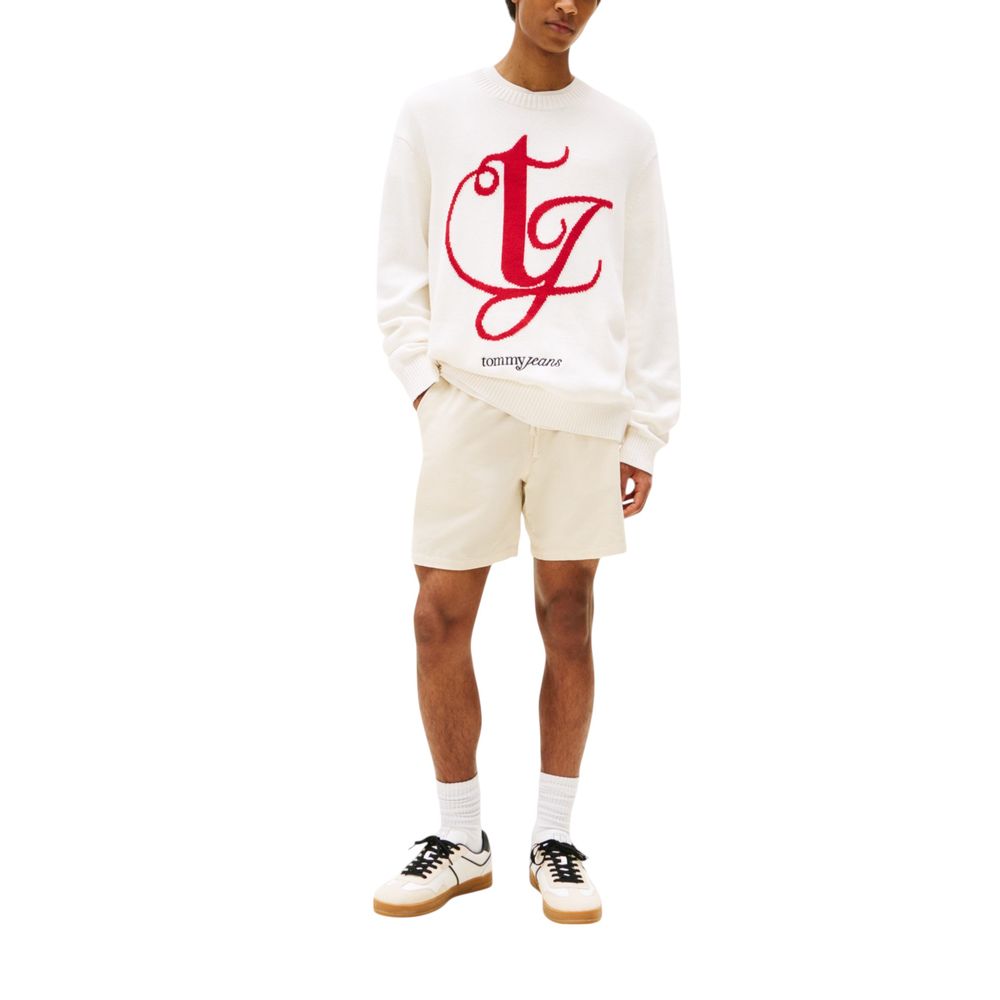 Man wearing white sweatshirt with red logo and shorts