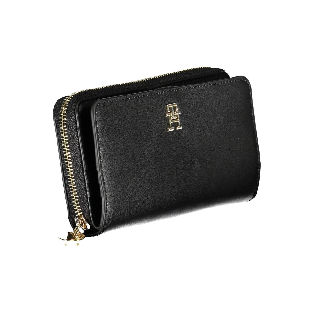 Black leather wallet with gold zipper and logo on front