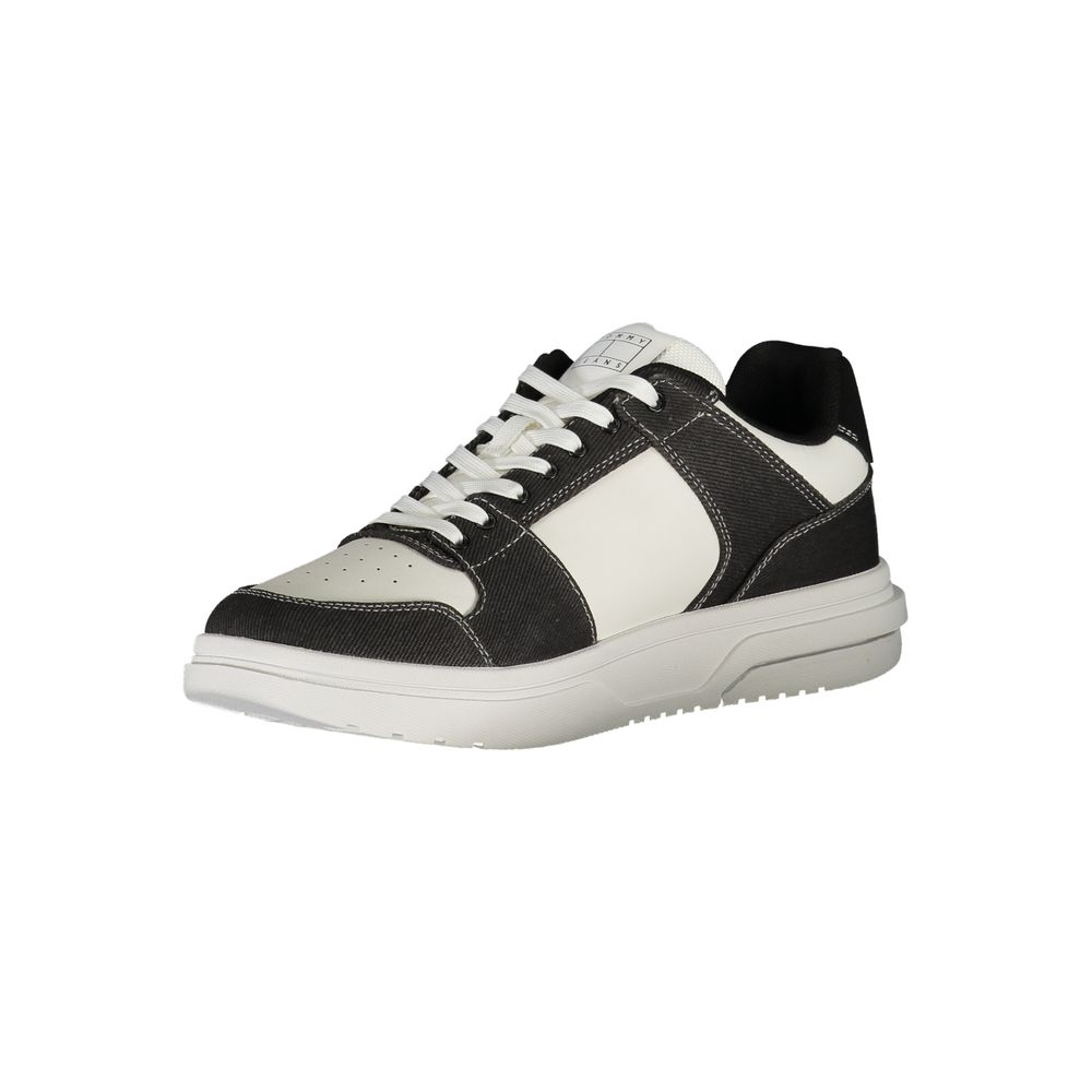 Black and white sneaker with laces, featuring a textured upper and a chunky sole