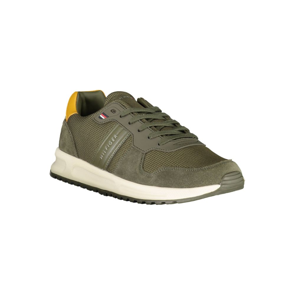 Pair of grey athletic shoes with white soles and yellow laces