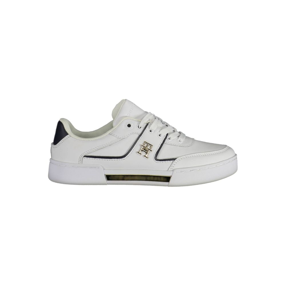 White sneaker with blue accents and gold logo on side