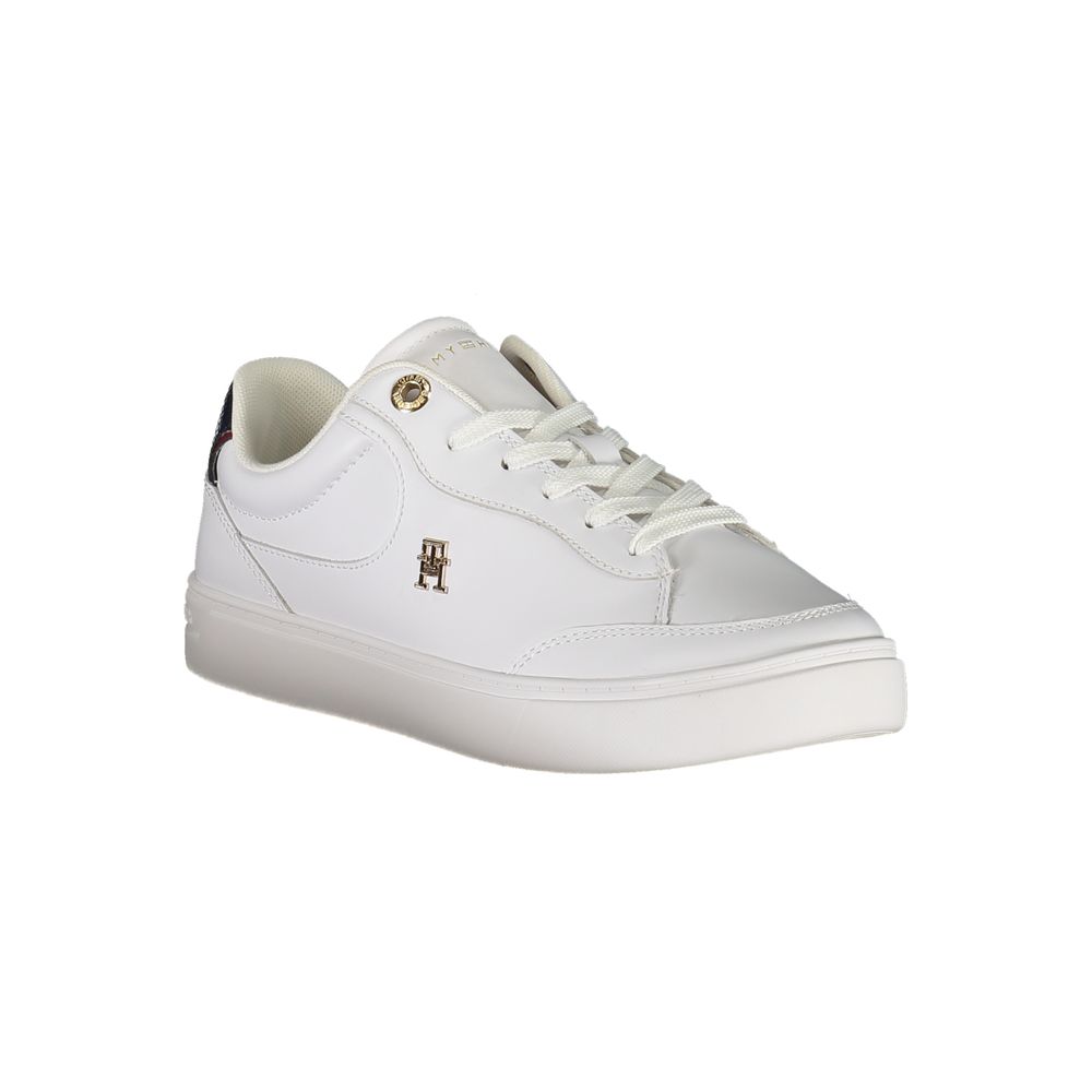 A white leather women's sneaker with a gold logo on the side, featuring laces and a flat sole