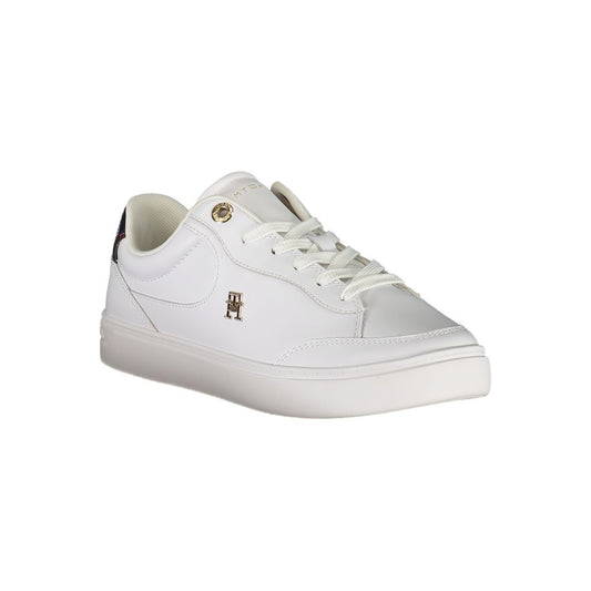 A white leather women's sneaker with a gold logo on the side, featuring laces and a flat sole