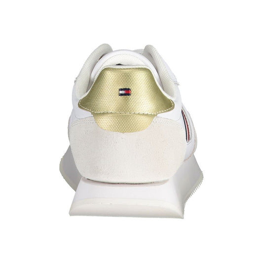 White sneaker with gold accents and red logo on side