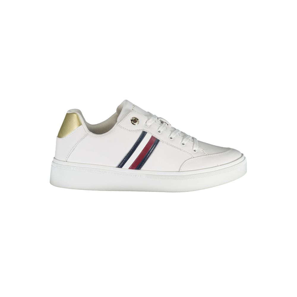 White sneaker with gold accents and blue stripes on side