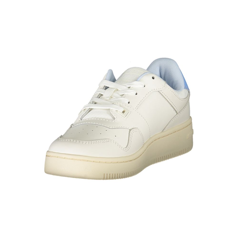 White sneaker with tan sole and blue laces
