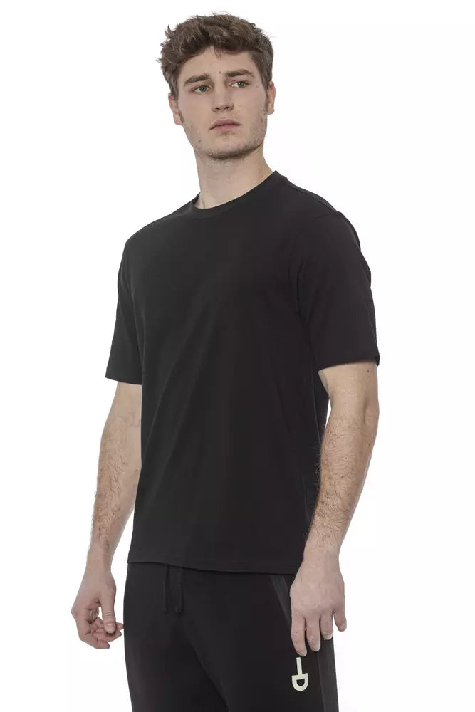 Man wearing black t-shirt and sweatpants