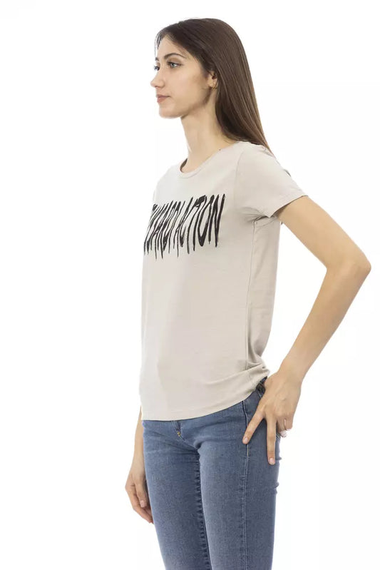 Woman wearing a beige t-shirt with black lettering