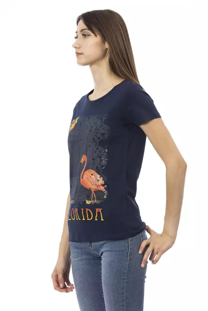 A woman wearing a blue t-shirt with an image of a cartoon character on it