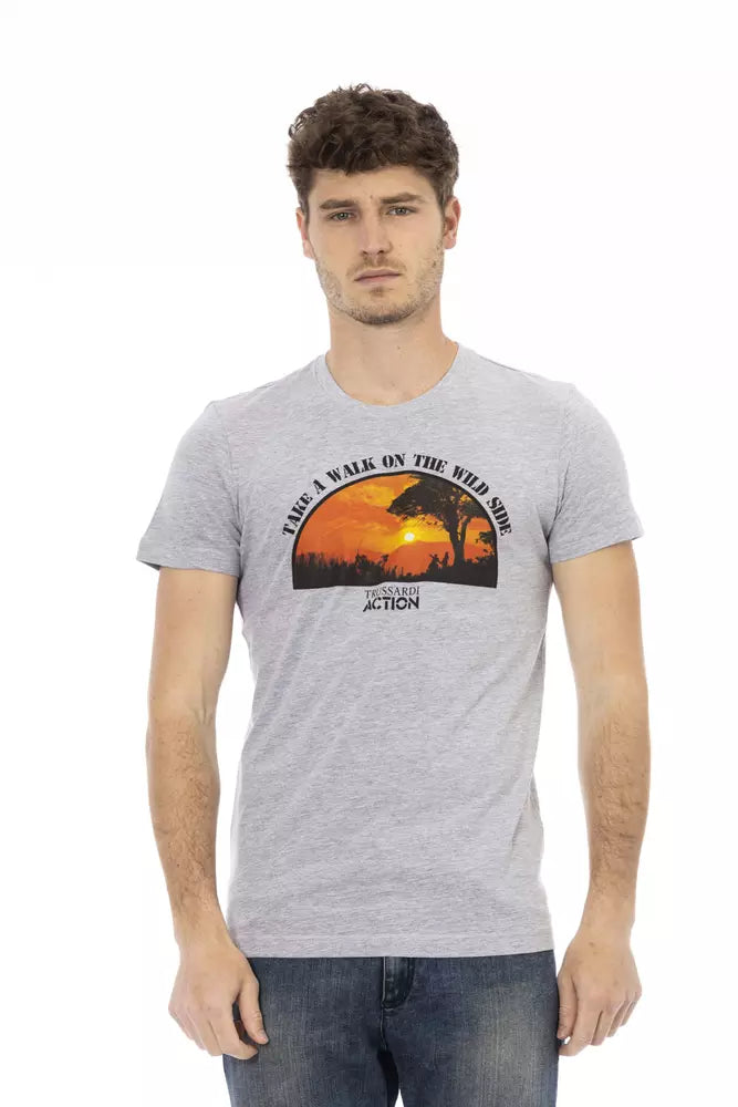 Man wearing gray t-shirt with graphic design on front