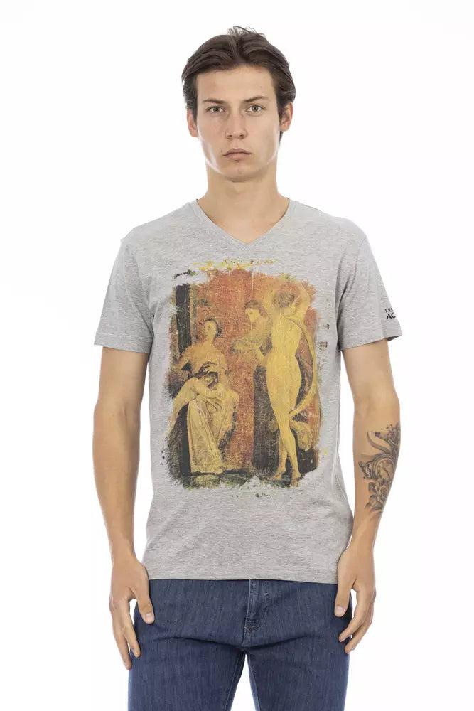 Man wearing gray t-shirt with artwork on front