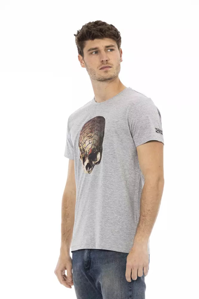Man wearing gray t-shirt with graphic design on front