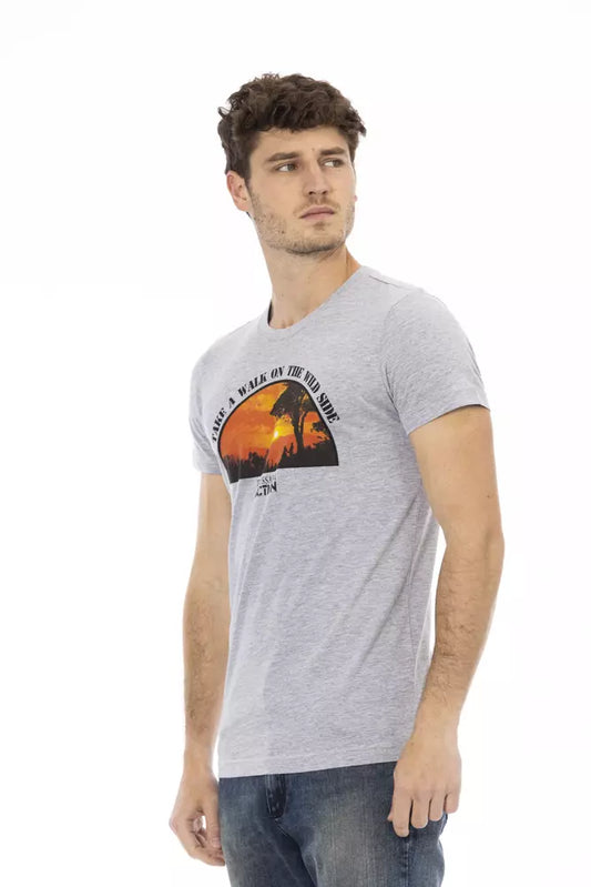 Man wearing gray t-shirt with graphic design on front