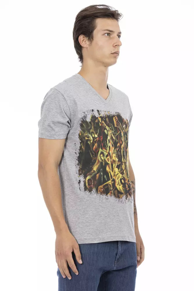 Man wearing gray t-shirt with graphic design on front