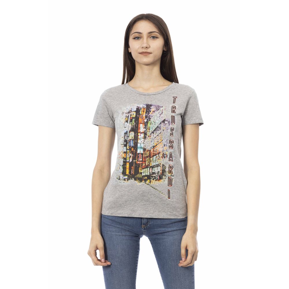 Woman wearing gray t-shirt with colorful graphic print