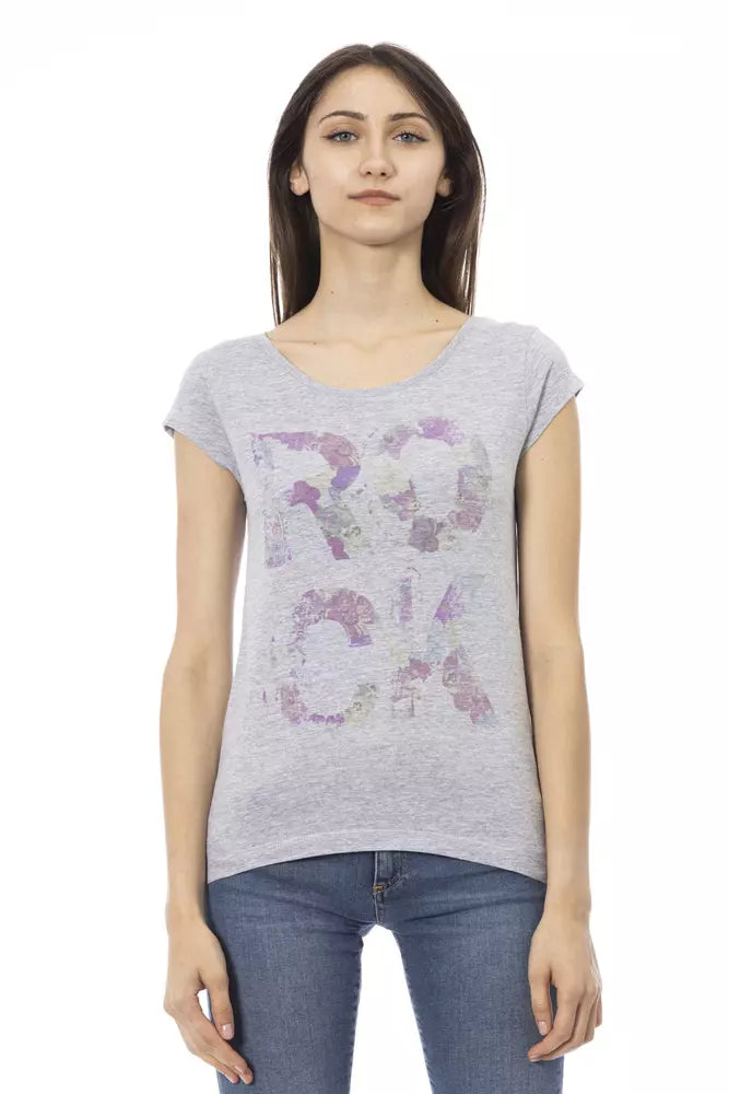 Woman wearing gray shirt with purple floral design