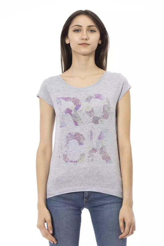 Woman wearing gray shirt with purple floral design