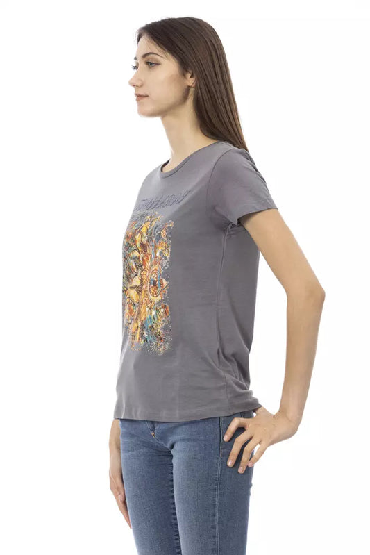 Woman wearing gray t-shirt with colorful graphic design on front